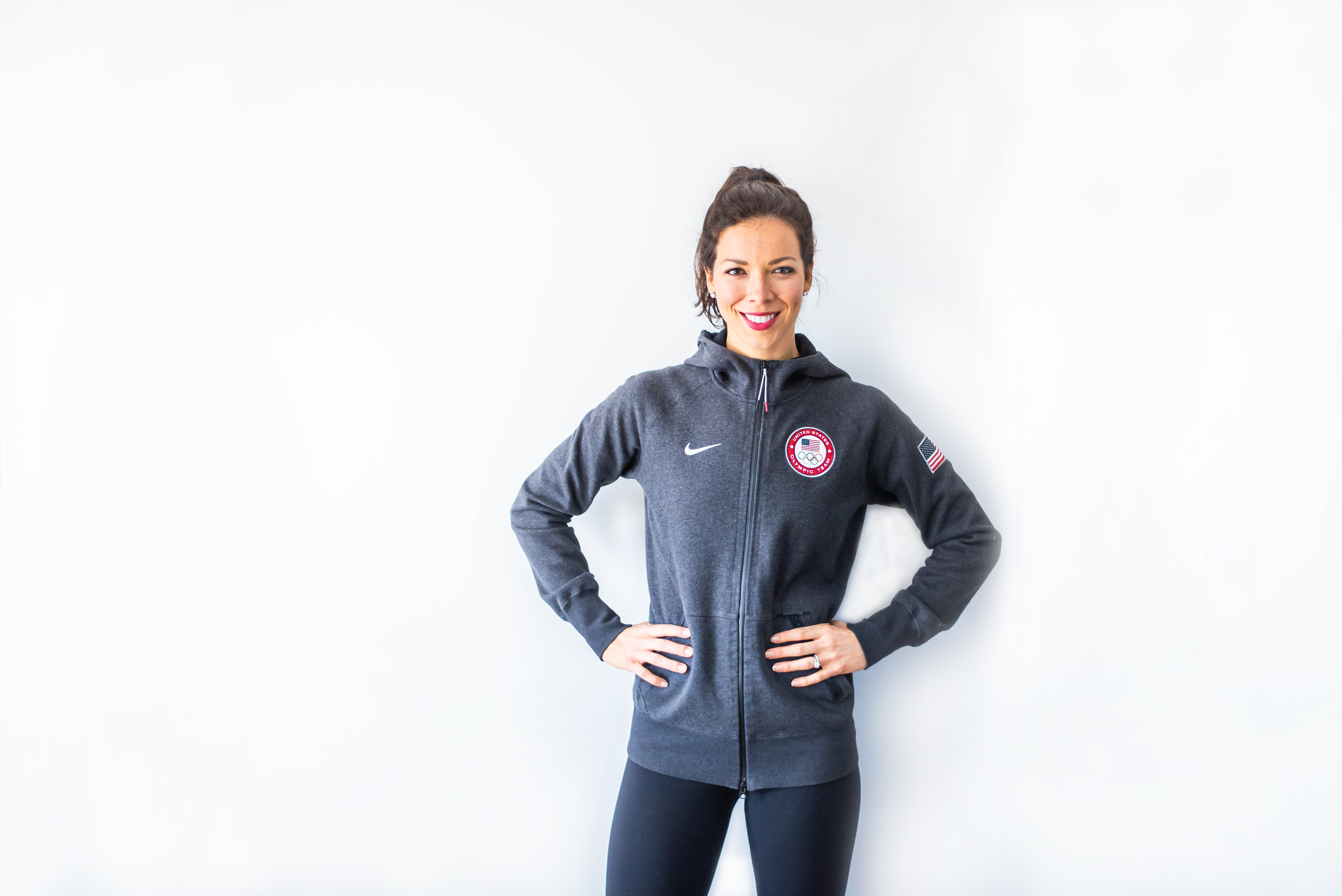 US Olympian, Kate Ziegler posing in Olympic gear with hand on hips